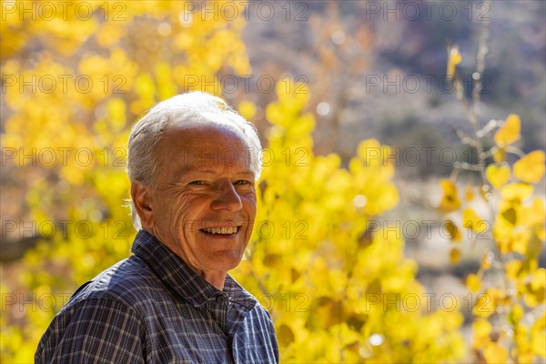 Senior man smiling and posing in Zion National Park