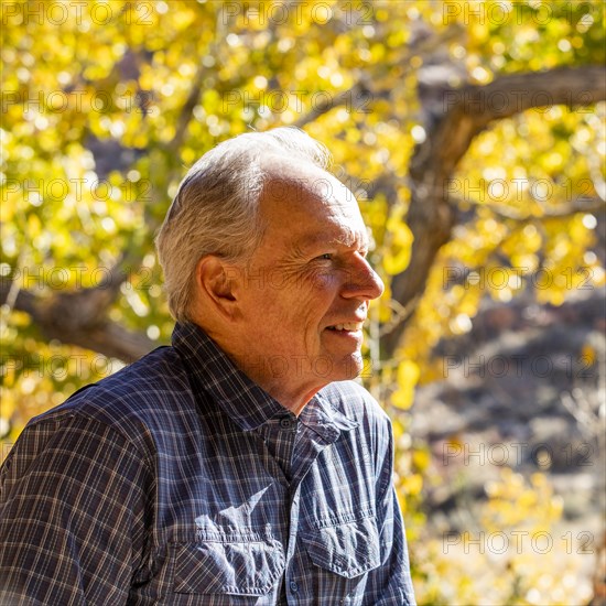 Senior man smiling and posing in Zion National Park