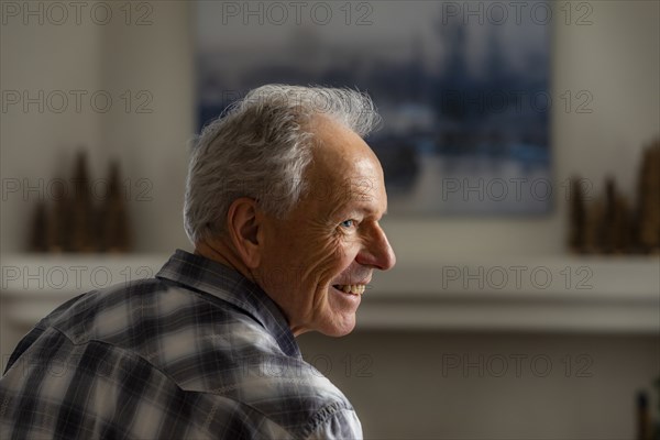 Profile view of senior man smiling