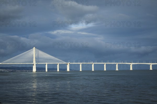 Vasco de Gama bridge under cloudy sky