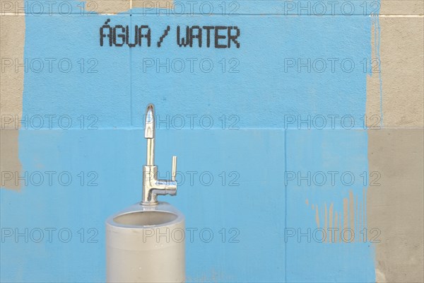 Water fountain and painting on wall