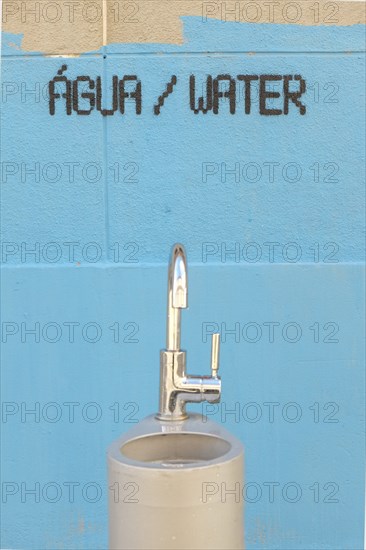 Water fountain and painting on wall