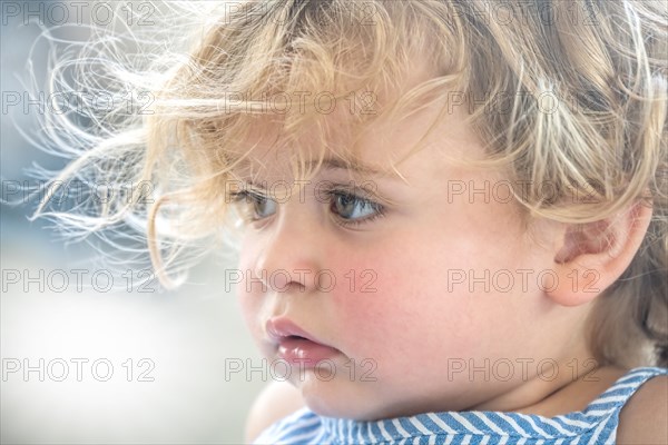 Close-up of cute blond girl