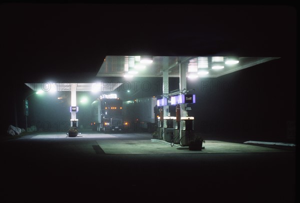Truck on gas station at night