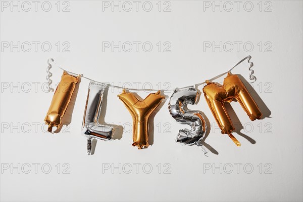 Gold and silver balloon ILYSM letters