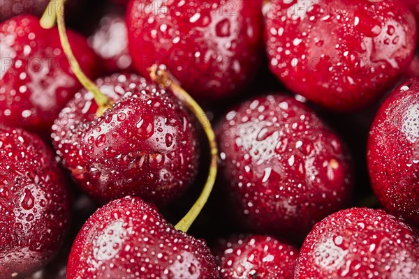 Close-up of fresh cherries with water drops