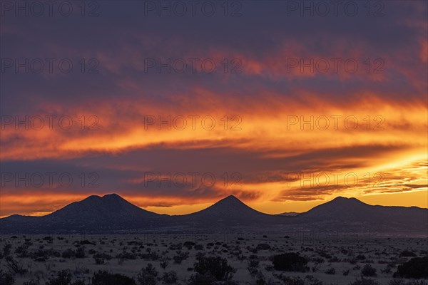 Dramatic sunset sky over Cerrillos Hills State Park desert landscape