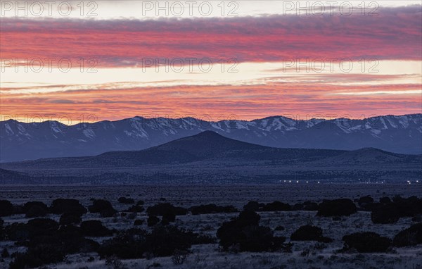 Dramatic sunset sky over Cerrillos Hills State Park desert landscape