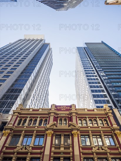 Low angle view of hotel between skyscrapers