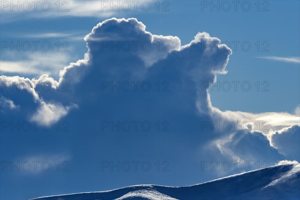 Backlit clouds in blue sky