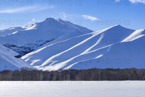 Winter landscape with snowy mountains