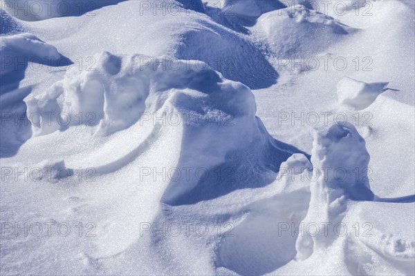 Close-up of snow formations on sunny day