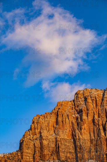 Scenic view of mountain peak against blue sky