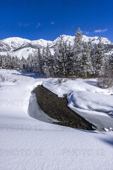 River flowing in mountains in winter