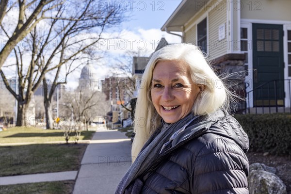 Portrait of senior woman on sidewalk