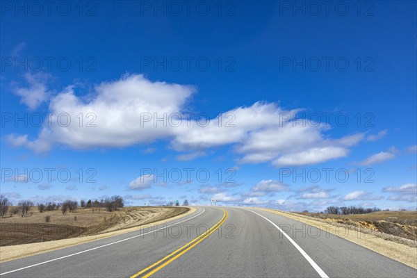 USA, Wisconsin, Madison, Empty highway with blue sky and clouds