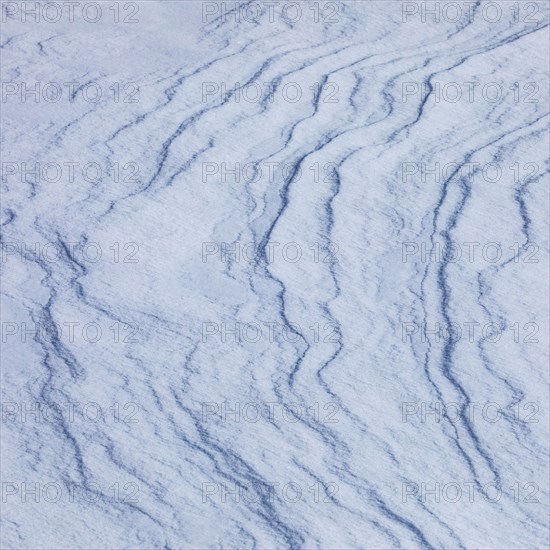 Abstract patterns on snow, full frame