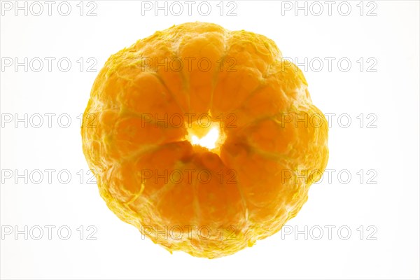 Peeled orange on white background