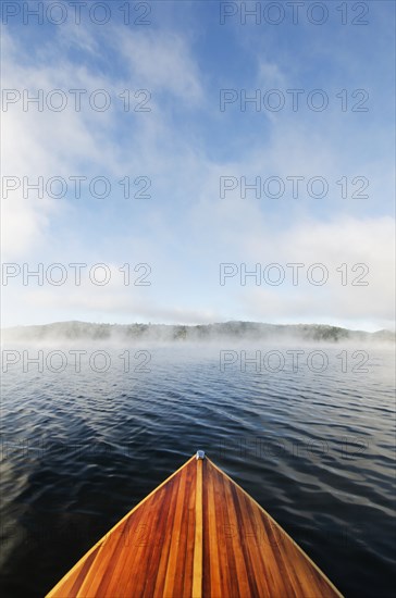 Boat on Lake Placid in morning mist