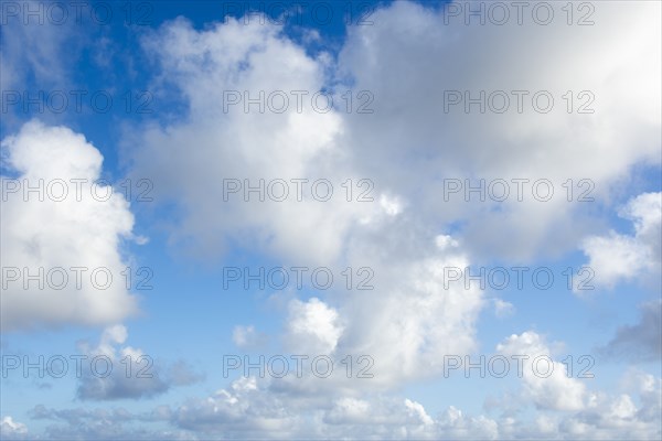 White puffy clouds against sky