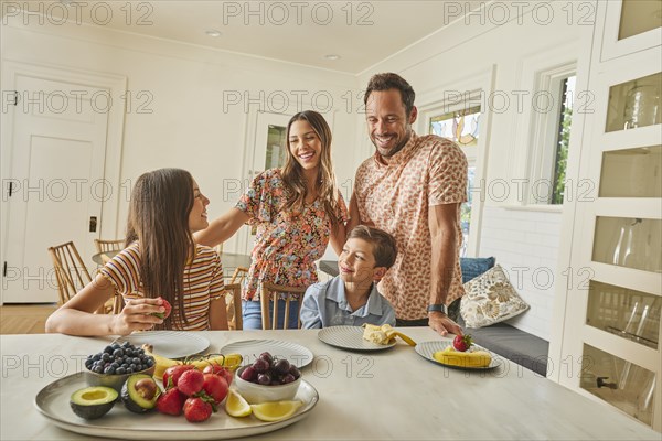 Smiling family with two children