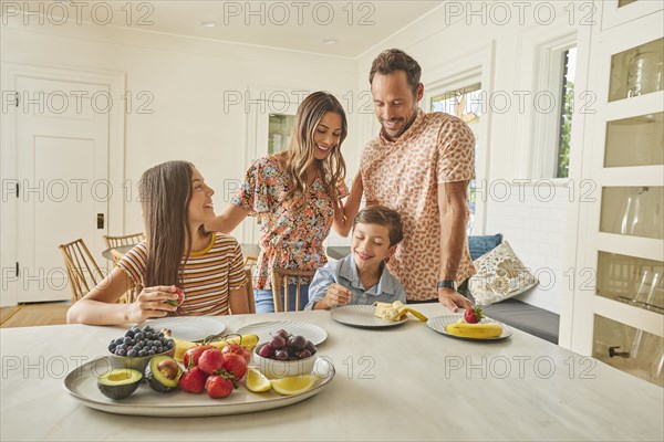 Smiling family with two children