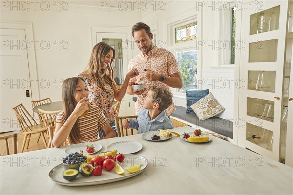 Smiling family with two children