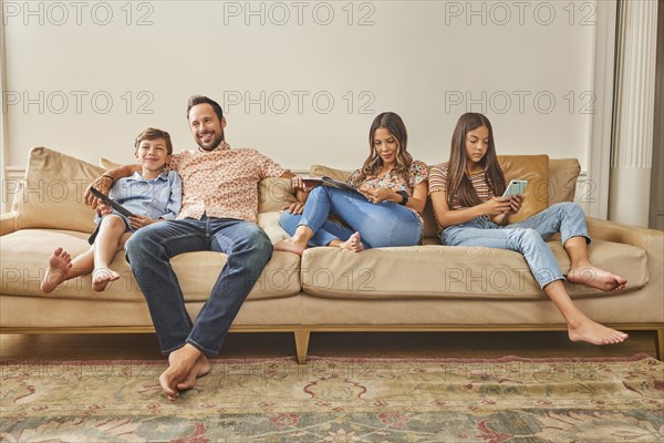 Smiling family with two children