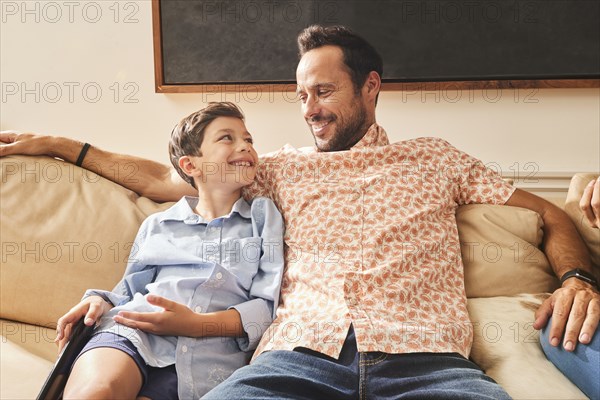 Smiling father and son