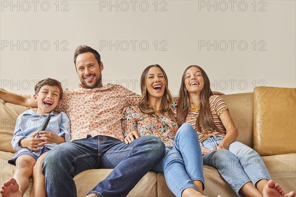 Smiling family with two children