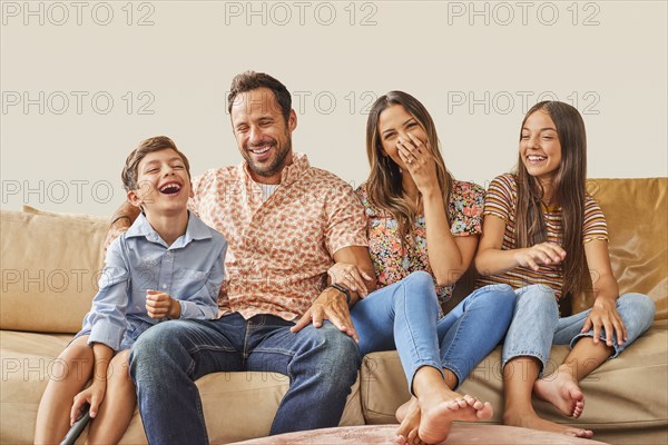 Smiling family with two children