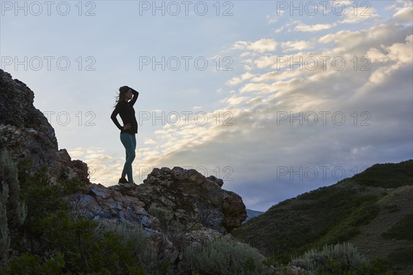 Mid adult woman hiking in mountains