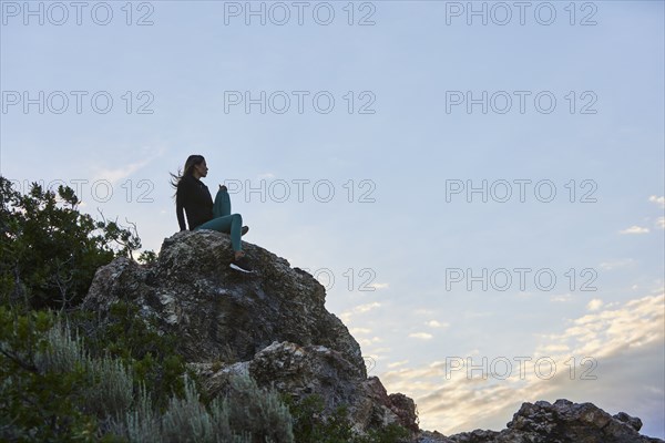 Mid adult woman hiking in mountains