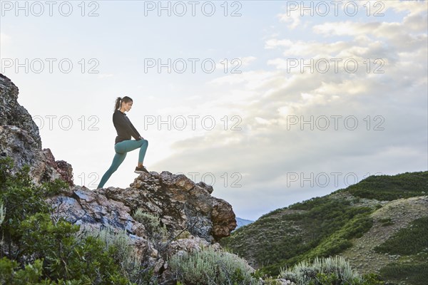 Mid adult woman hiking in mountains