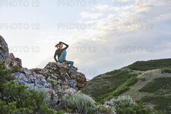 Mid adult woman hiking in mountains