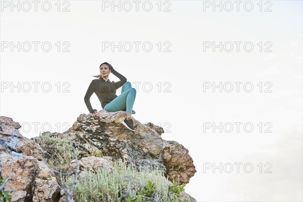 Mid adult woman hiking in mountains