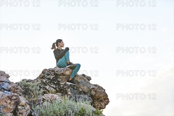 Mid adult woman hiking in mountains