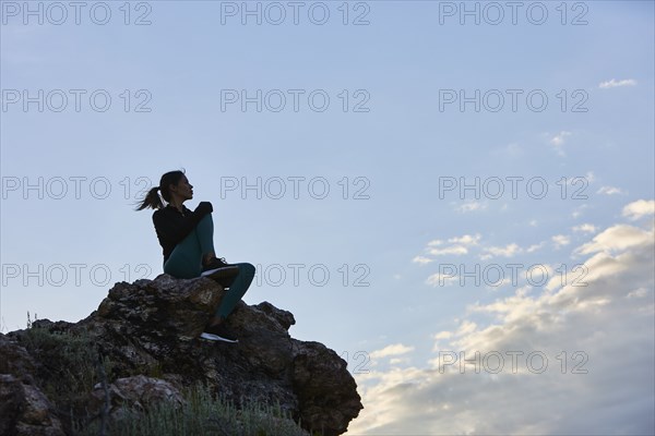 Mid adult woman hiking in mountains