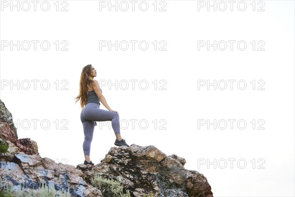 Mid adult woman hiking in mountains