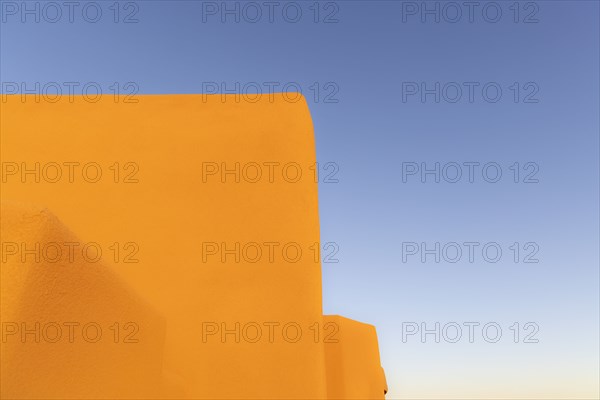 Adobe walls against blue sky