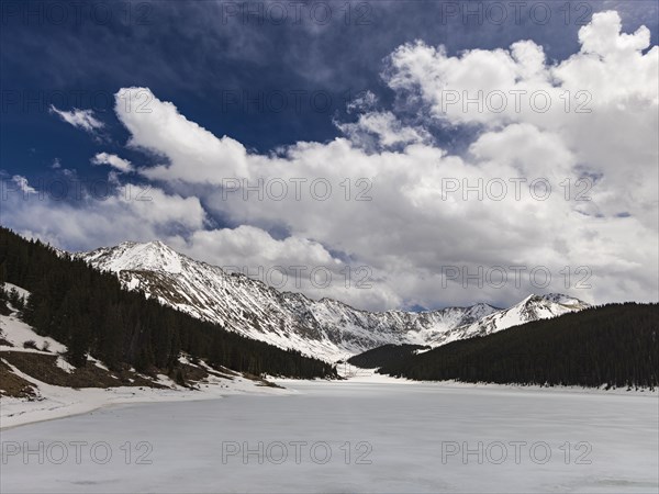 Snowy Rocky Mountains landscape on sunny day