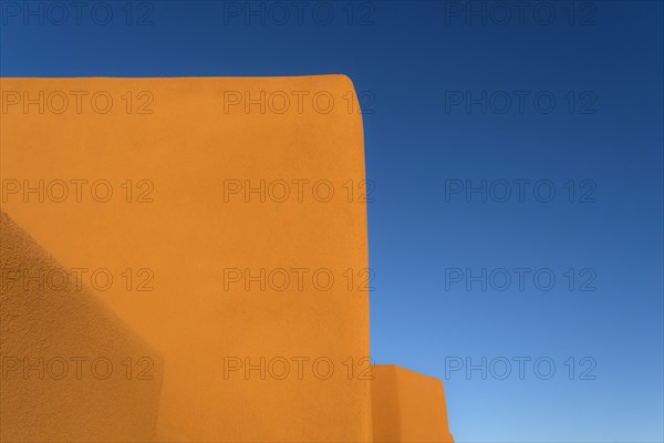 Adobe walls against blue sky