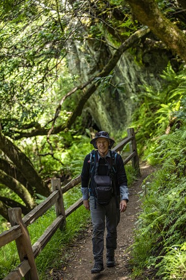 Smiling senior man hiking Dipsea Trail