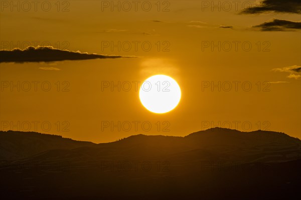 Setting sun seen above mountains near Sun Valley