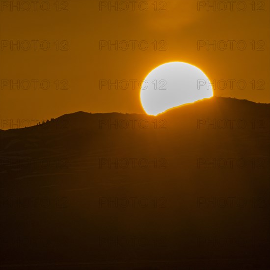 Setting sun seen above mountains near Sun Valley