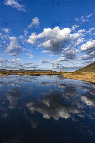 Clouds reflecting in lake near Sun Valley