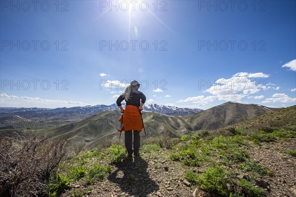 Senior blonde woman on top of Carbonate Mountain