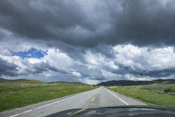 Storm clouds gathering above highway