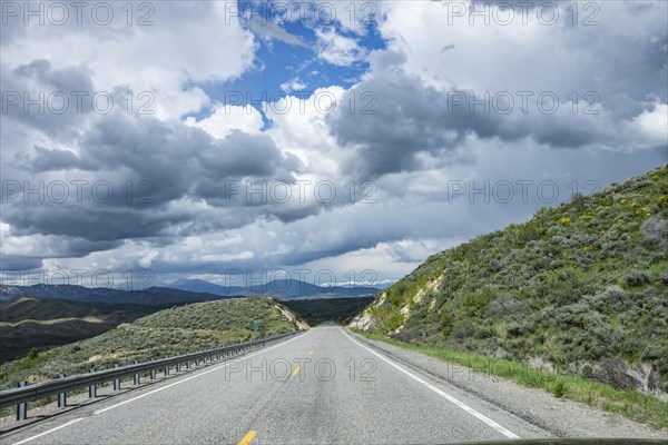 Storm clouds gathering above highway