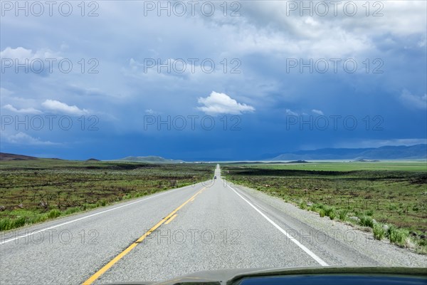 Storm clouds gathering above highway